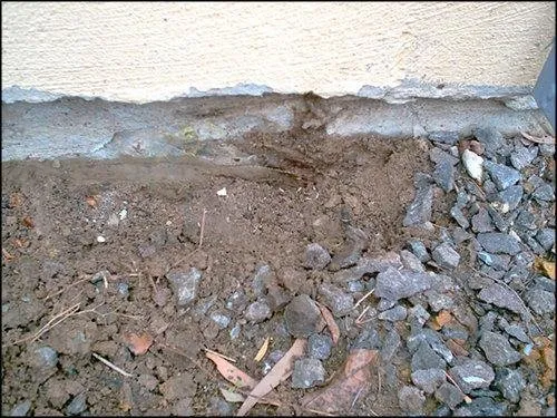 Wood to soil contact creating termite entry point in Peoria home